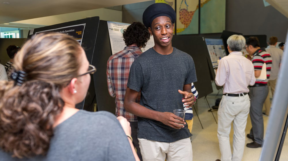 Postdoc presenting research at Georgia Tech Postdoctoral Research Symposium