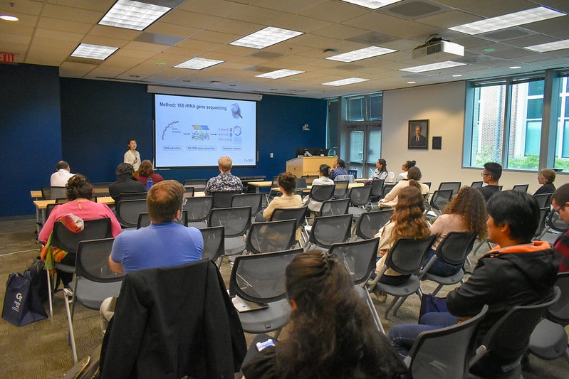 Postdoc presenting research to audience at Georgia Tech Postdoctoral Research Symposium