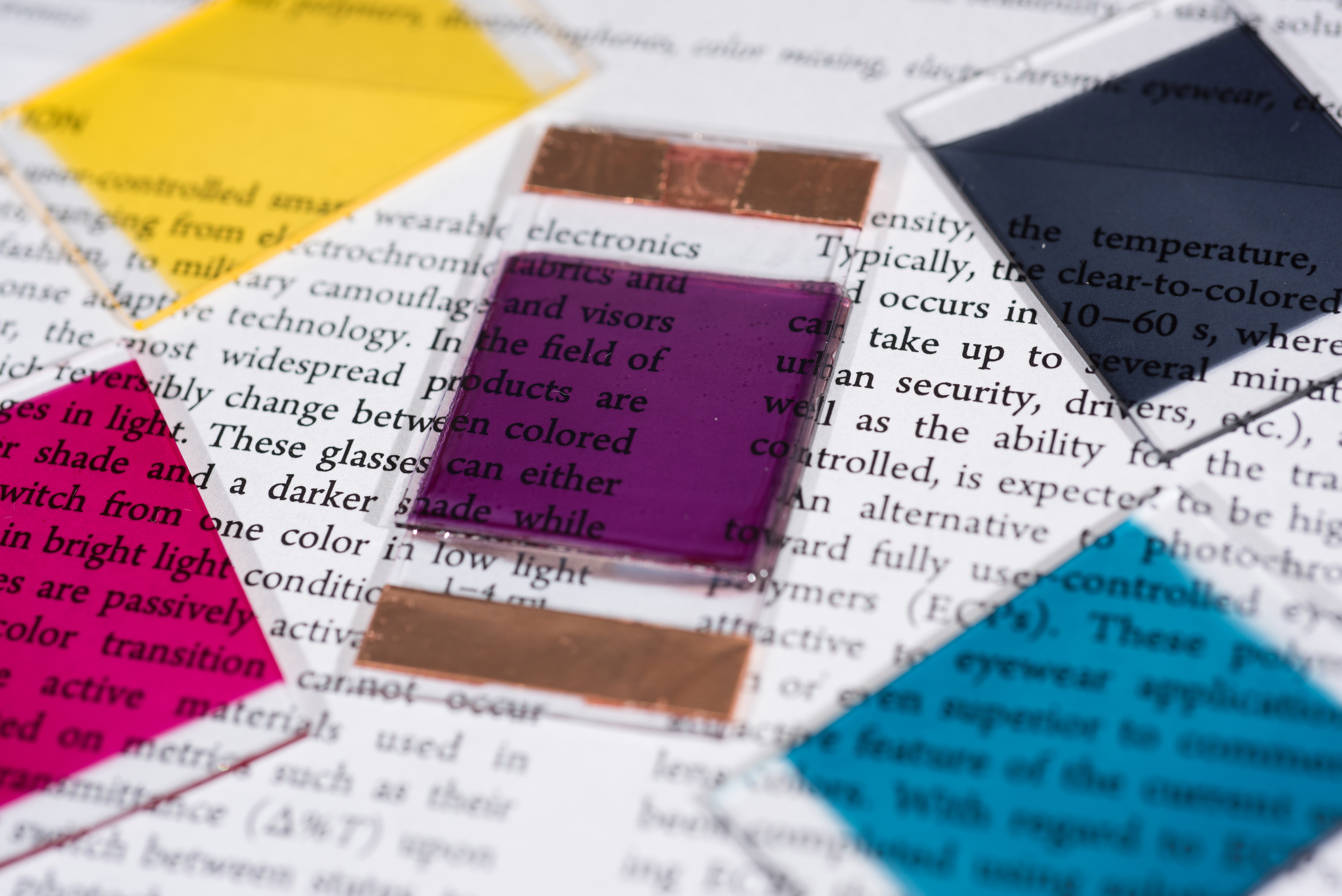 Samples show some of the colors researchers have produced in electrochromic polymers. The materials can be used for applications such as sunglasses and window tinting that can be turned on and off through the application of an electrical potential. (Credit: Rob Felt) Samples show some of the colors researchers have produced in electrochromic polymers. The materials can be used for applications such as sunglasses and window tinting that can be turned on and off through the application of an electrical potential. (Credit: Rob Felt)
