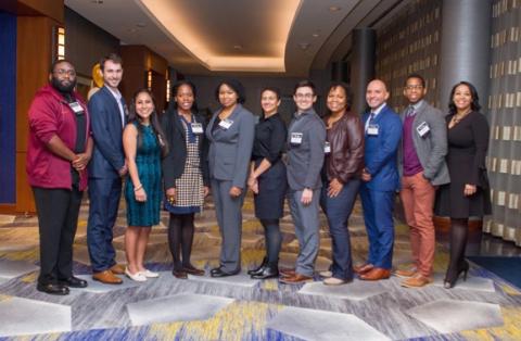 Standing with Sybrina Atwaters, assistant director for outreach initiatives at OMED: Educational Services (right), the Intel-supported Focus Fellows are doctoral students who are considering an academic career.
